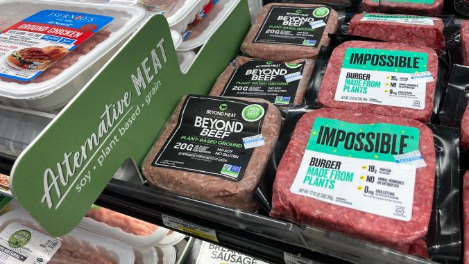 Burgers and sausage in the alternative meat section of grocery store