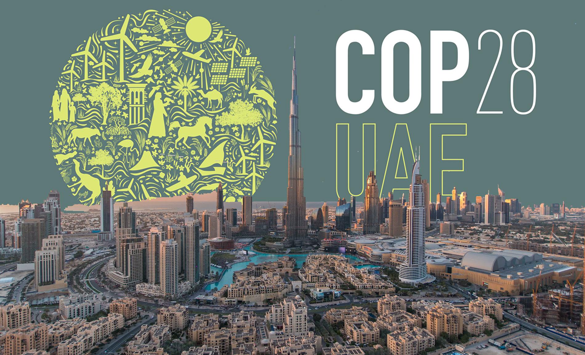 Dubai skyline with COP28 logo behind it.