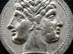 An ancient Roman coin depicting the two-faced god Janus.
