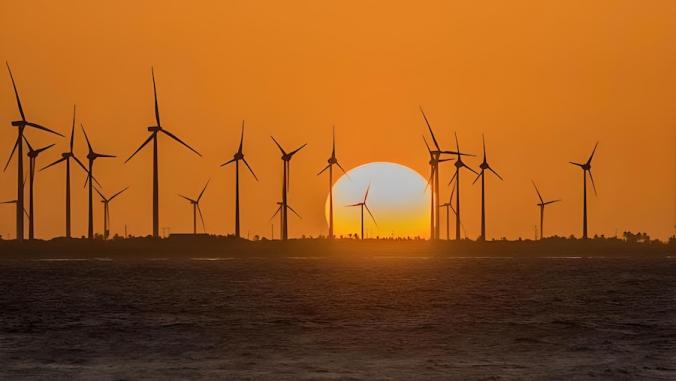 Wind turbines during a sunset