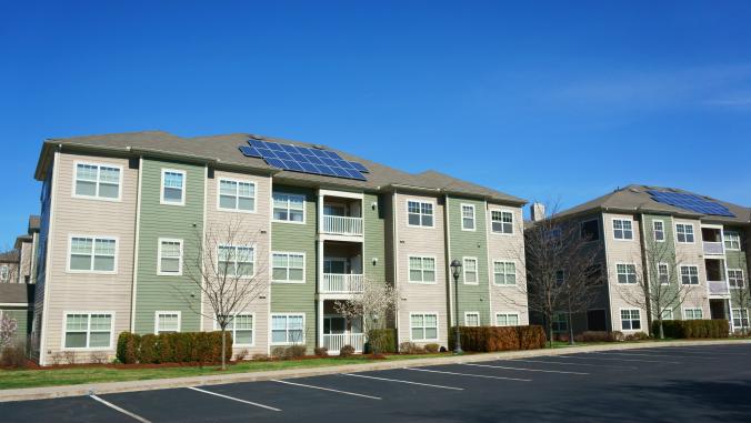 Solar panels on a multiunit apartment building.