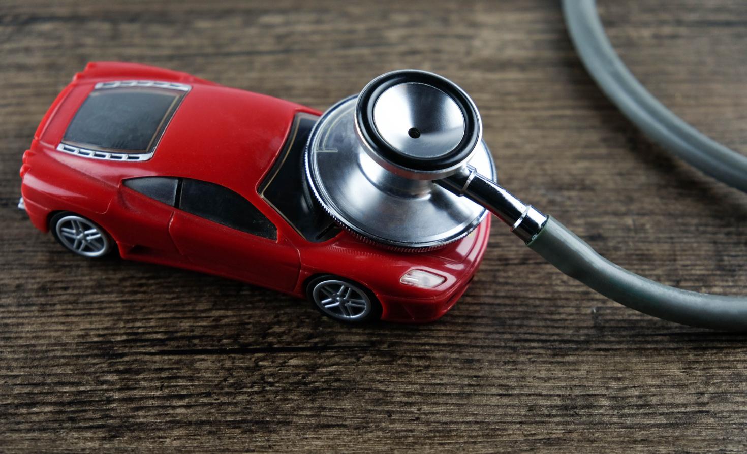 A stethoscope 'listens' to a toy car.
