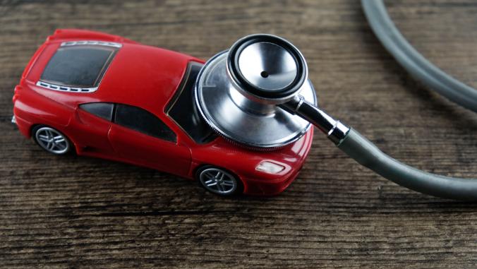 A stethoscope 'listens' to a toy car.