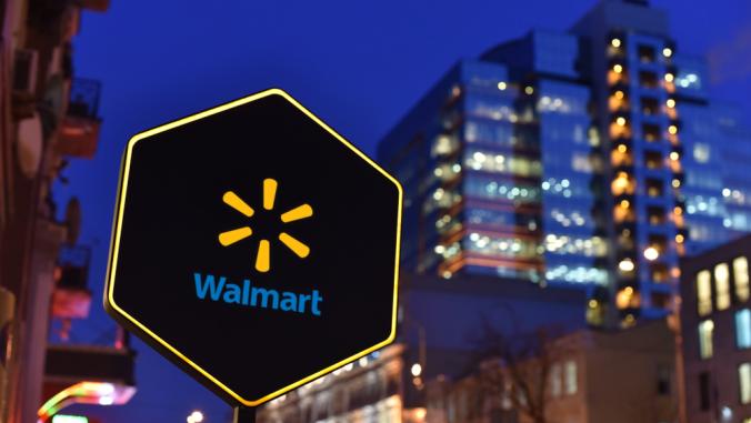 Walmart sign with skyscrapers in background